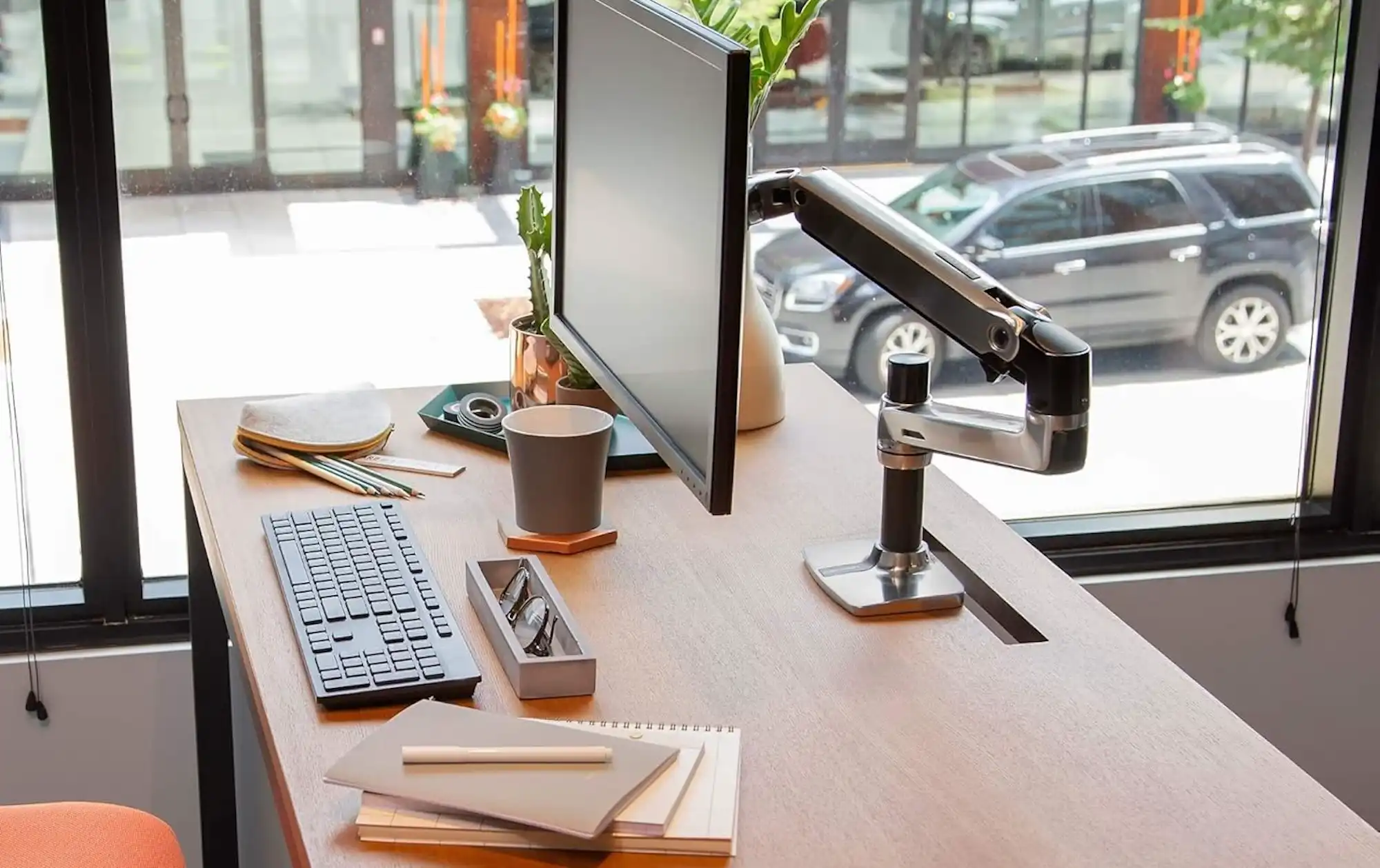 Lift Your Mac Display: Monitor Arms for Better Ergonomics and Cleaner Desks